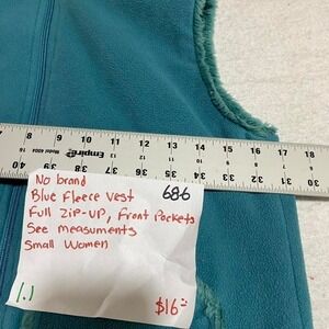 No visible brand/size Blue fleece vest with front pockets women small. SKU686